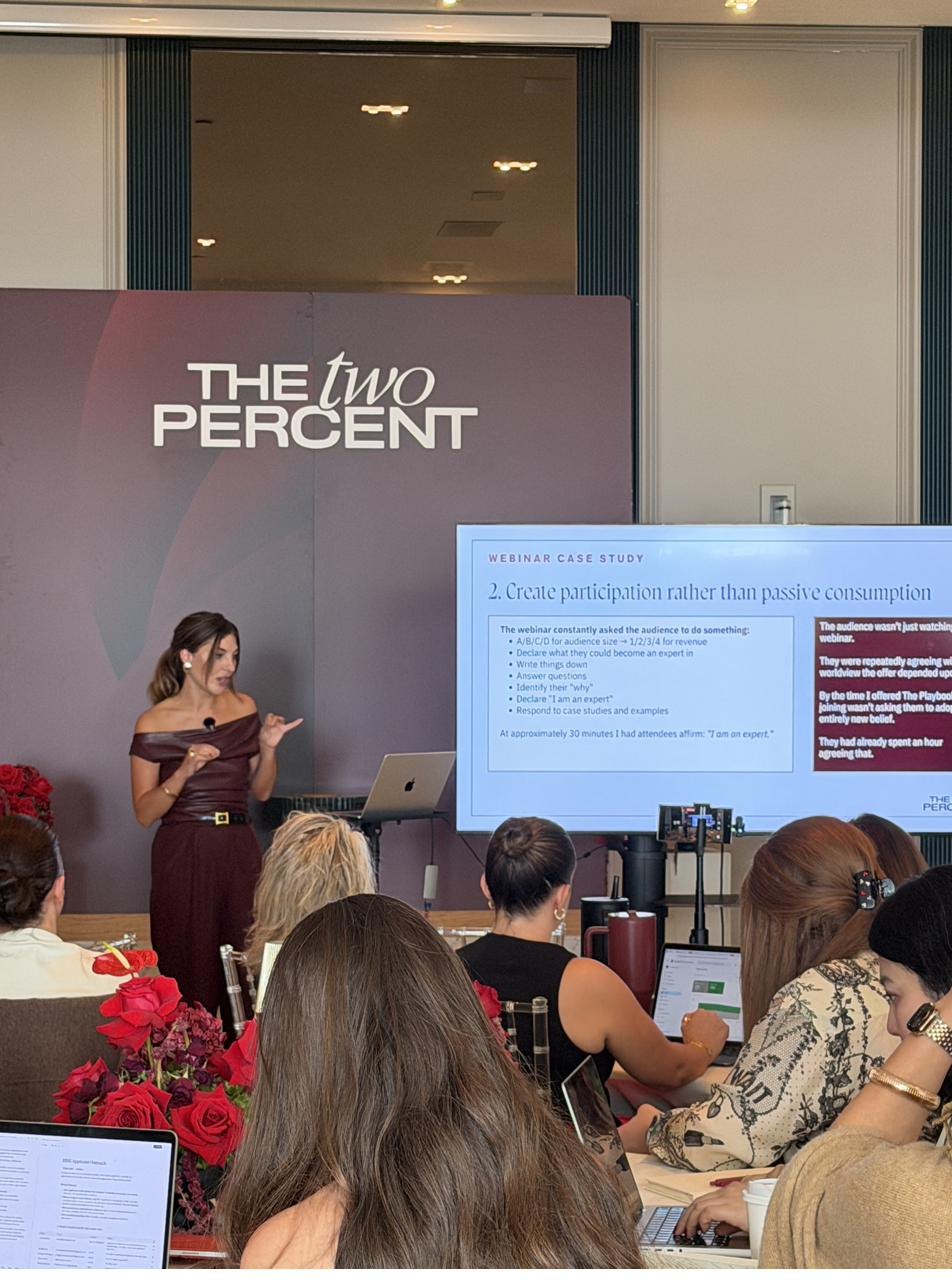 Danielle teaching on stage at The Two Percent